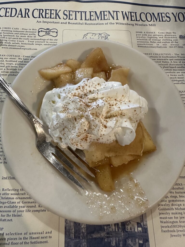 Rob Peter to Pay Paul dessert crepe stuffed with hot apples with cinnamon and sugar and topped with whipped cream