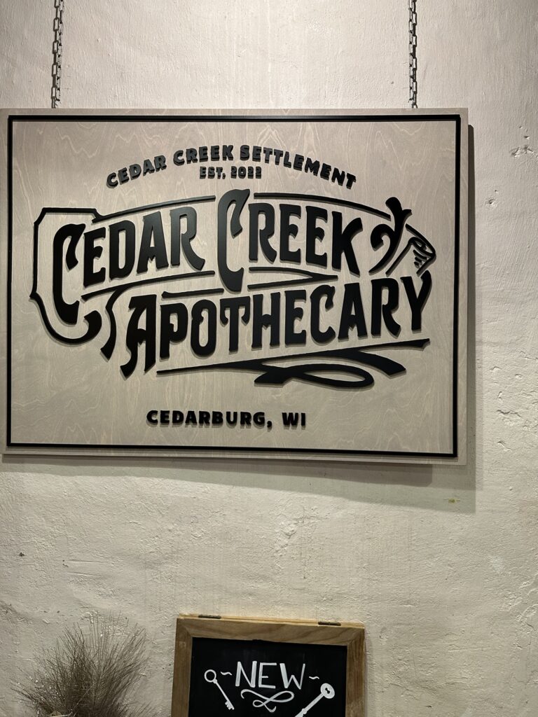 store sign for Cedar Creek Apothecary