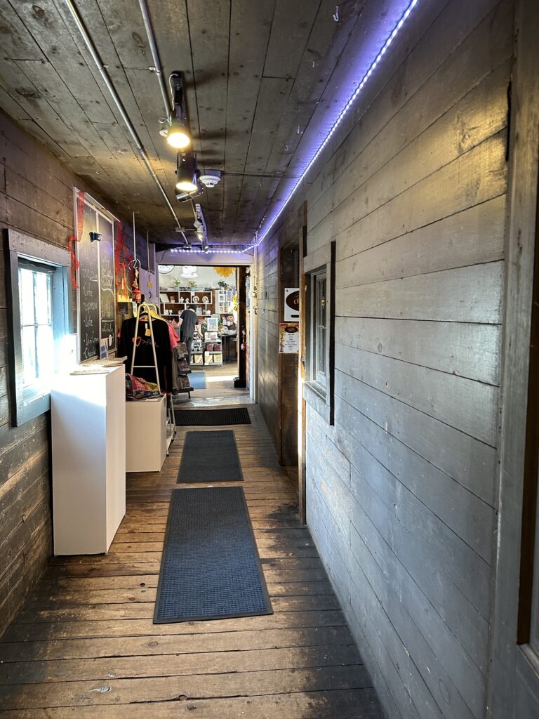 hallway in the Shops of Cedar Creek Settlement building leading to the Fair Brew and Trade coffee shop