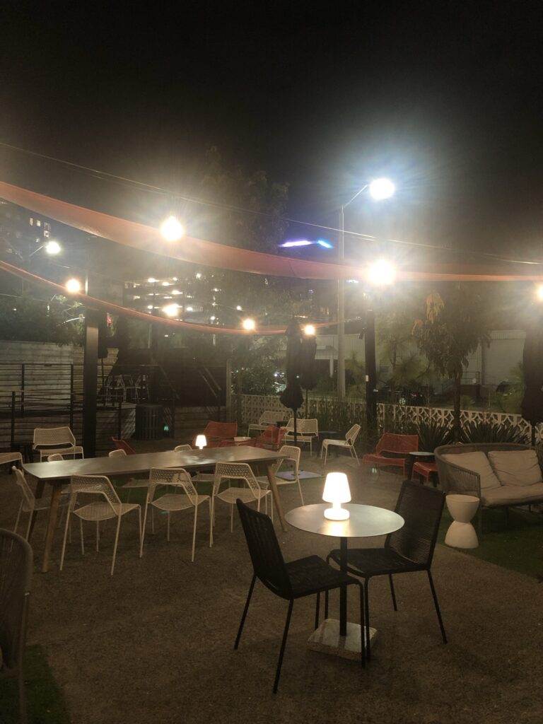 The lit up patio at night at the Longleaf.