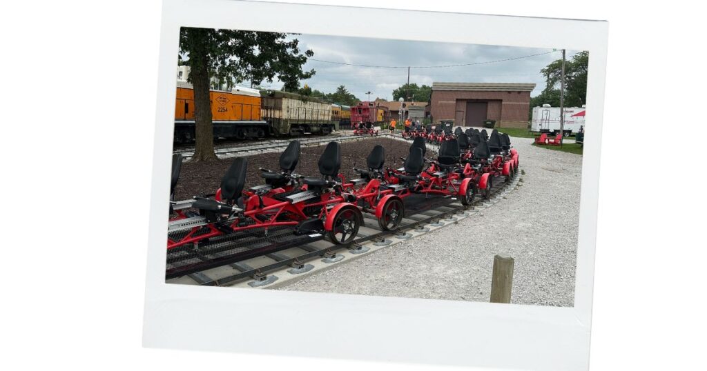 Another picture of the rail bikes. Some are a 4-seater and some are a 2-seater. They are red with black seats.