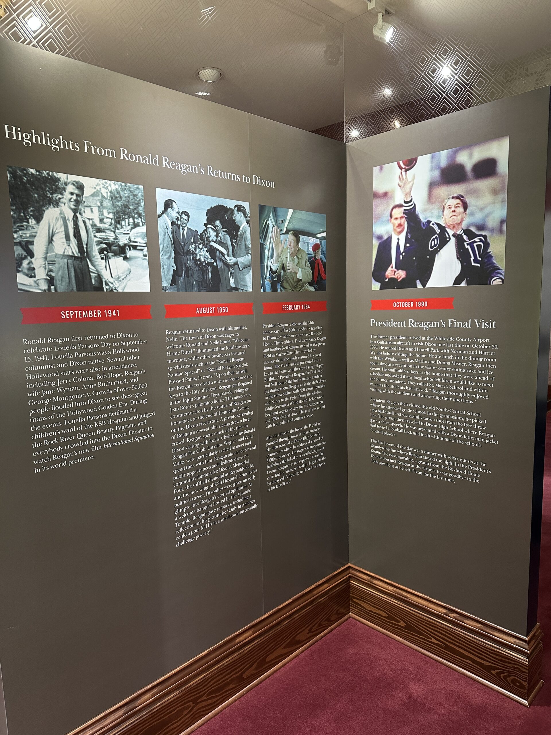 Display panel titled "Highlights From Ronald Reagan’s Returns to Dixon" featuring four sections with images and text detailing Reagan’s visits to his hometown. The sections, dated September 1941, August 1950, February 1984, and October 1990, describe events such as Louella Parsons Day, his visit with actress wife Nancy, a presidential campaign stop, and his final return as a former president. Prominent photo shows Reagan waving in a letterman jacket during his last visit.